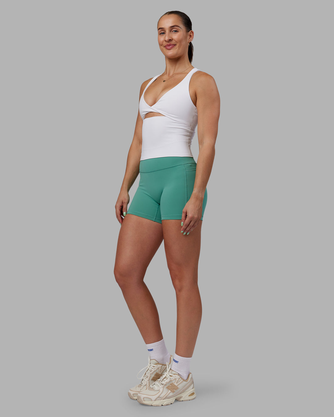 Woman wearing Abs Agile Tank - White | Model:Abbey | Size:M
