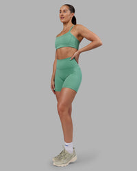 Woman wearing Abs Ignite Sports Bra - Matcha Green | Model:Abbey | Size:M