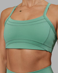 Woman wearing Abs Ignite Sports Bra - Matcha Green | Model:Abbey | Size:M
