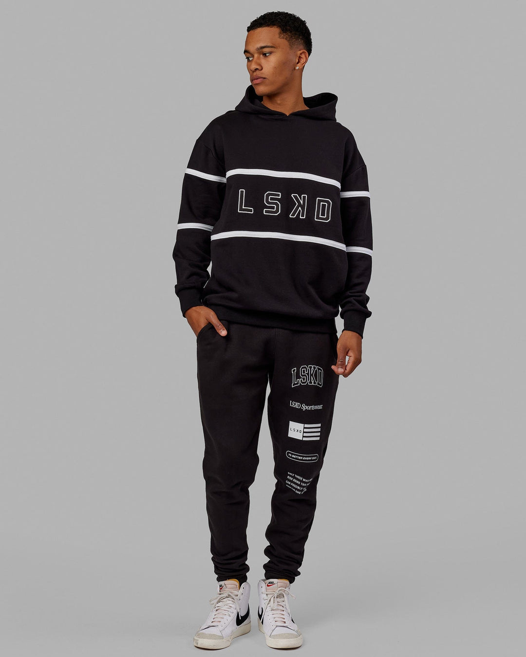 Man wearing Unisex Academy Track Pant - Black