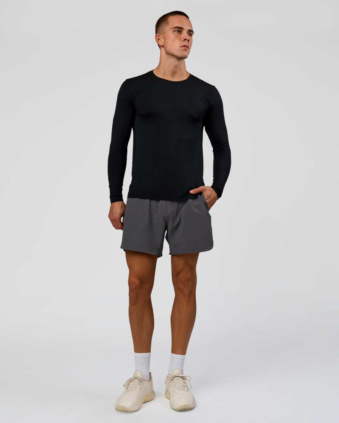 Man wearing AeroFLX+ Seamless Long Sleeve Tee (Set in Sleeve) in Black/Black | Model:Albert | Size:M