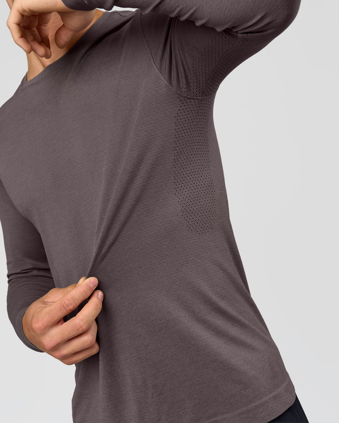 Man wearing AeroFLX+ Seamless Long Sleeve Tee (Set in Sleeve) in Duskstone/Duskstone | Model:Albert | Size:M