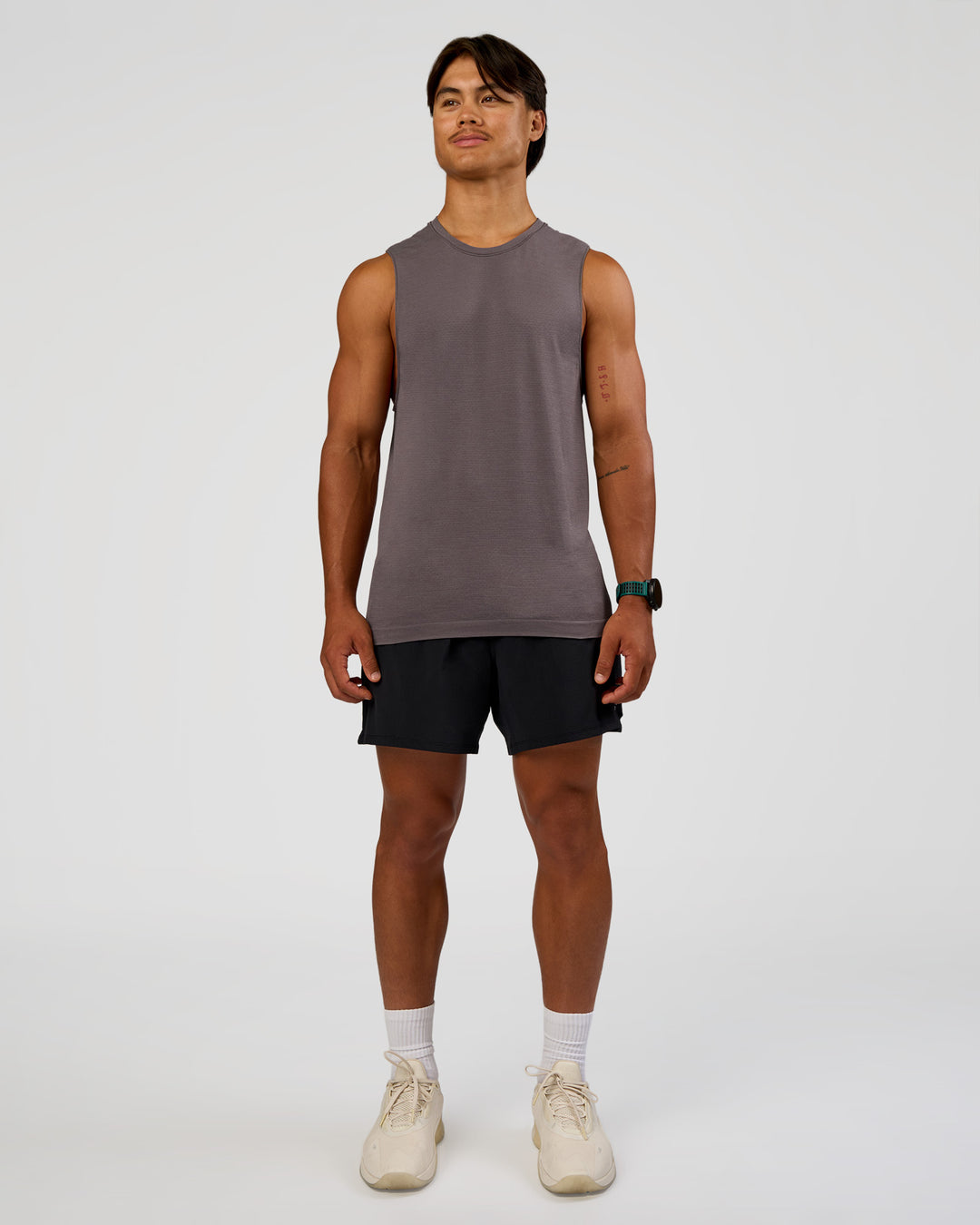 Man wearing AeroFLX+ Seamless Muscle Tank - Duskstone/Duskstone | Model:George | Size:M