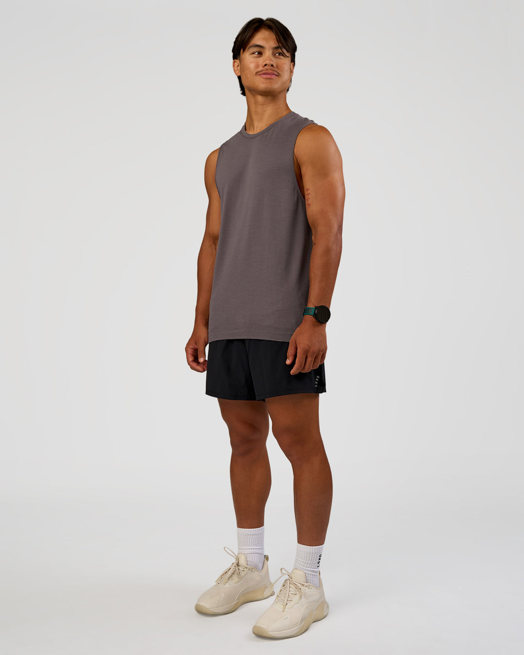 Man wearing AeroFLX+ Seamless Muscle Tank - Duskstone/Duskstone | Model:George | Size:M
