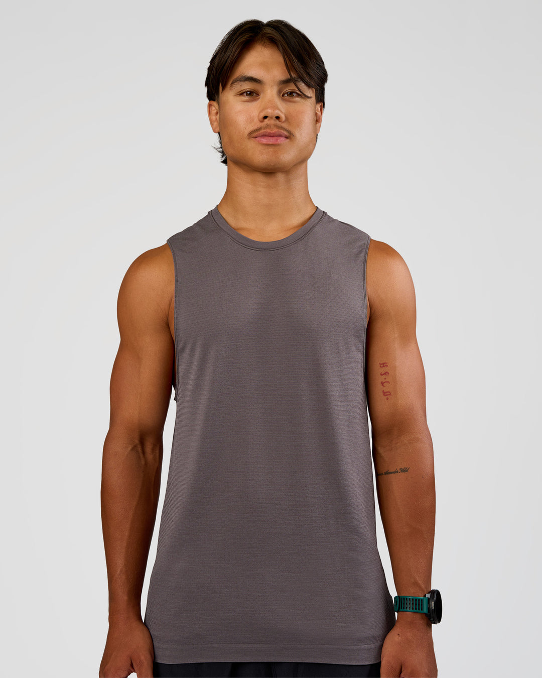 Man wearing AeroFLX+ Seamless Muscle Tank - Duskstone/Duskstone | Model:George | Size:M