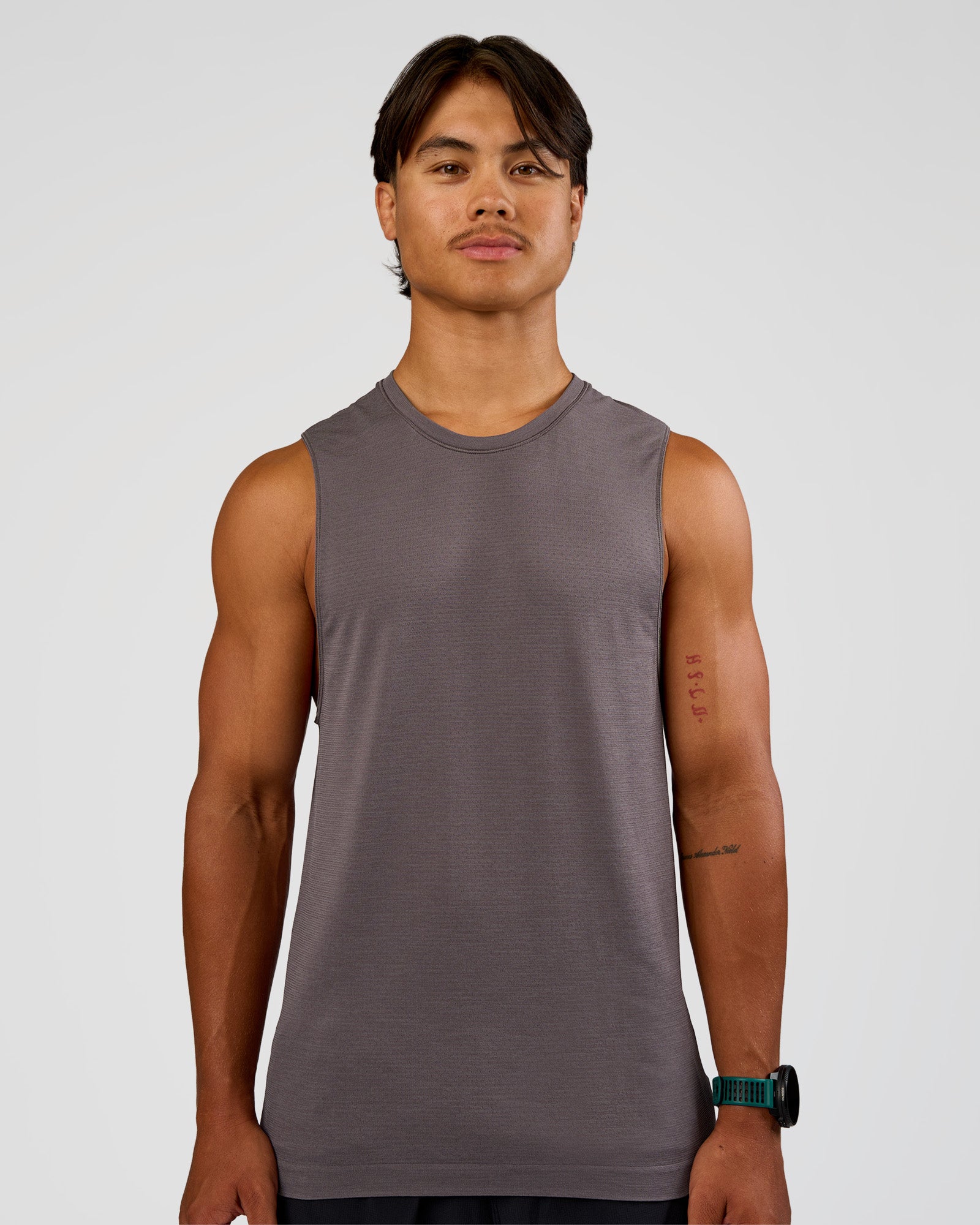 Man wearing AeroFLX+ Seamless Muscle Tank - Duskstone/Duskstone | Model:George | Size:M