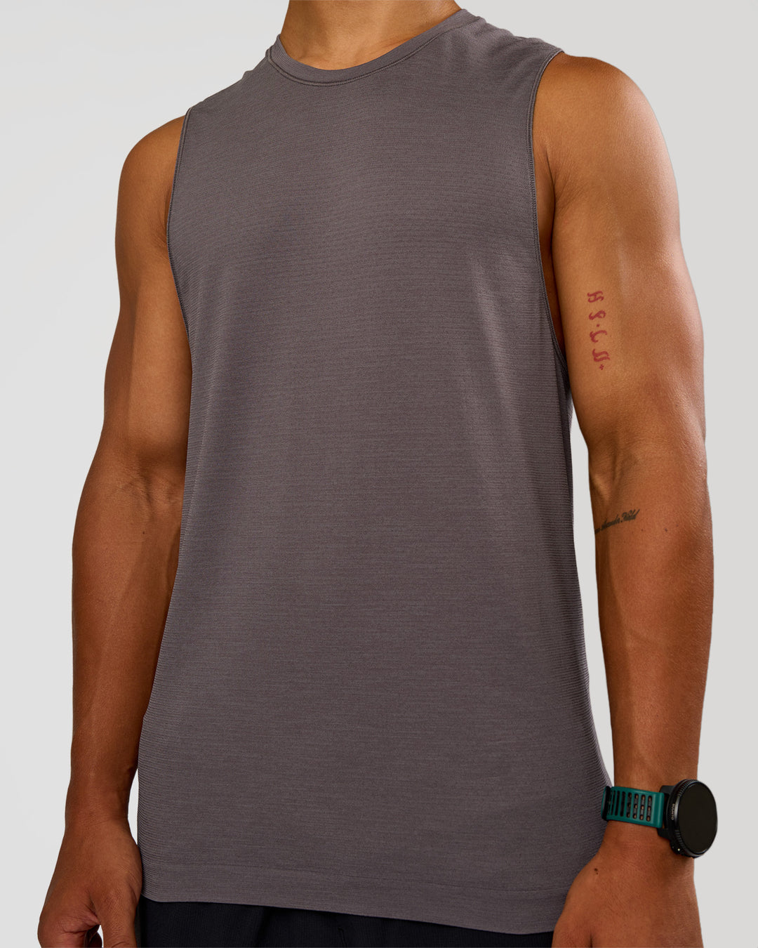 Man wearing AeroFLX+ Seamless Muscle Tank - Duskstone/Duskstone | Model:George | Size:M