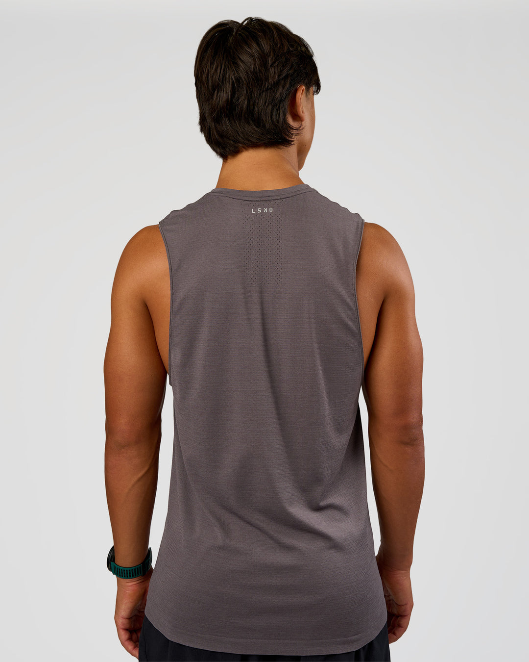 Man wearing AeroFLX+ Seamless Muscle Tank - Duskstone/Duskstone | Model:George | Size:M