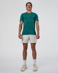 Man wearing AeroFLX+ Seamless Set In Tee - Teal/Teal | Model:Konnor | Size:M