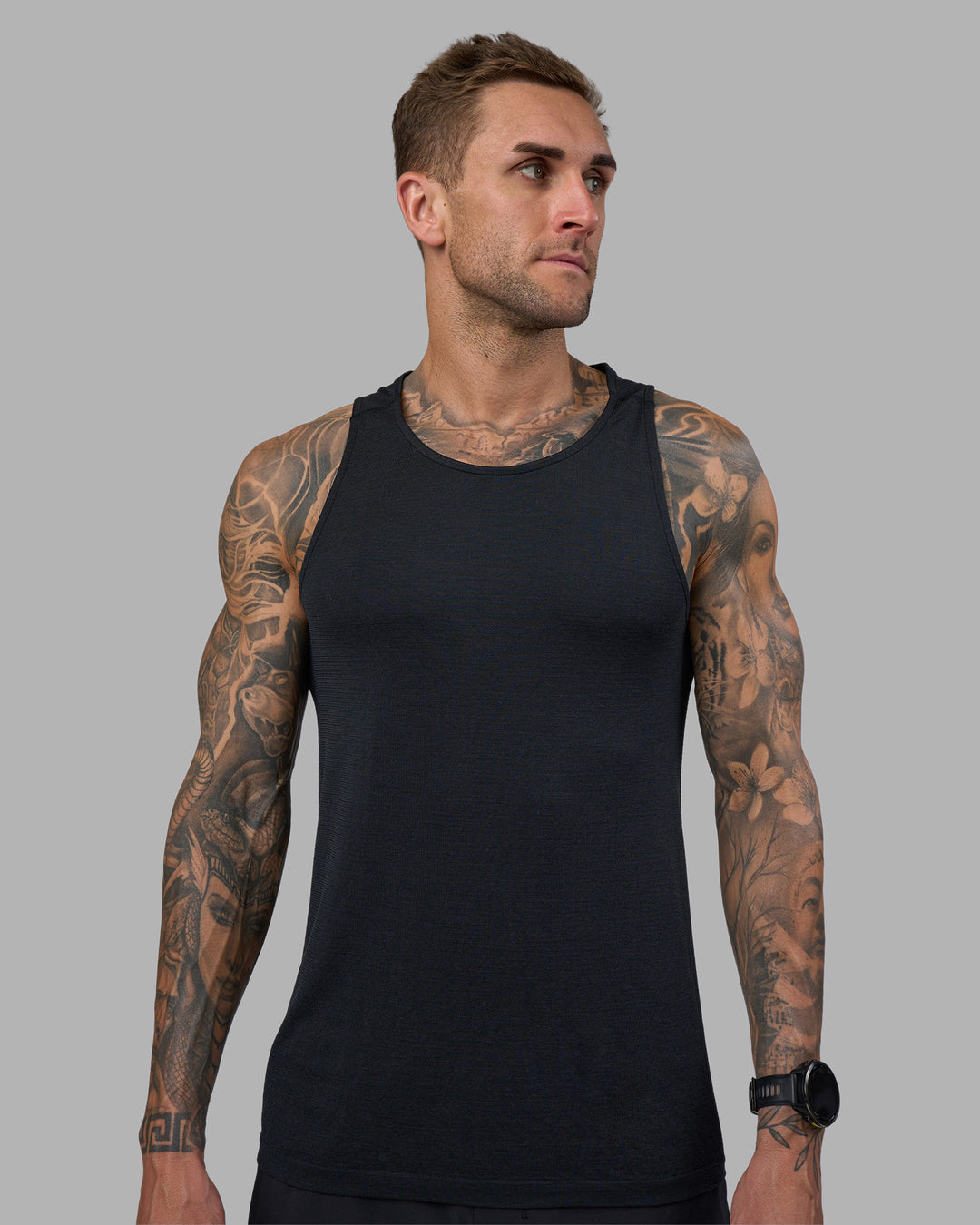 Man wearing AeroFLX+ Seamless Tank - Black Marl | Model:Tommy | Size:M