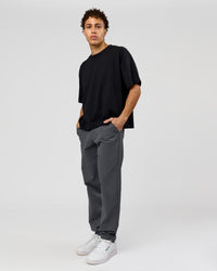 Man wearing AfterDark ZeroCrease Boxy Tee in Black | Model:Leandro | Size:M