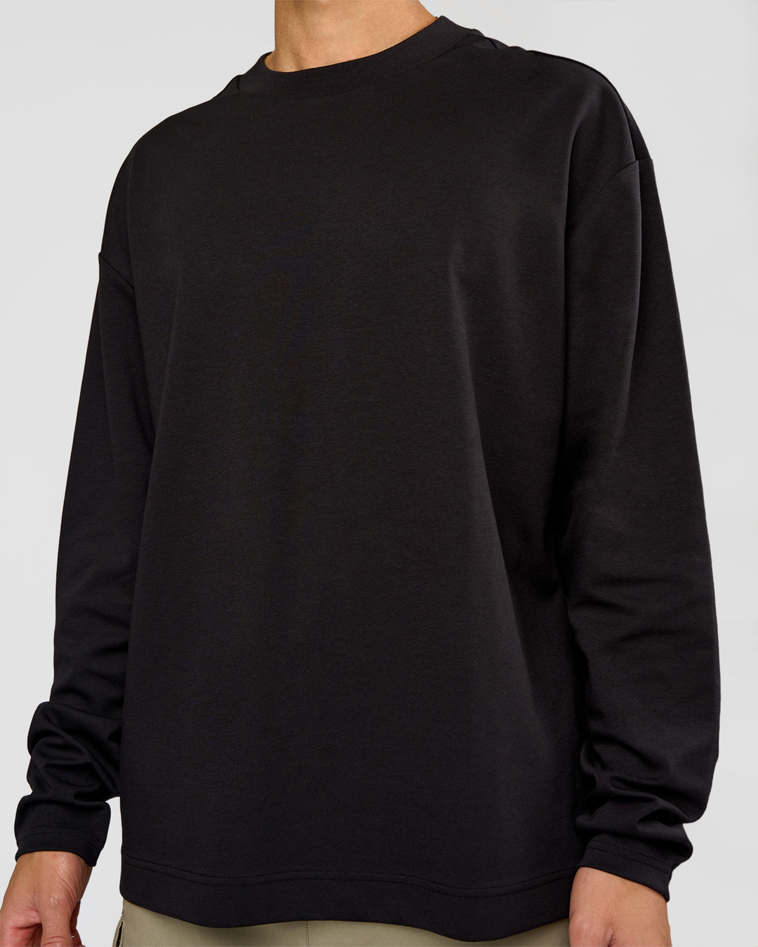 Man wearing AfterDark ZeroCrease Long Sleeve Tee - Black | Model:Leandro | Size:M