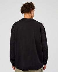 Man wearing AfterDark ZeroCrease Long Sleeve Tee - Black | Model:Leandro | Size:M