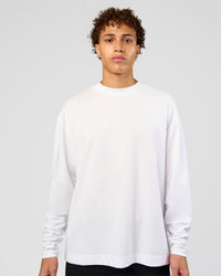 Man wearing AfterDark ZeroCrease Long Sleeve Tee - White | Model:Leandro | Size:M