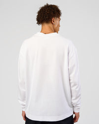 Man wearing AfterDark ZeroCrease Long Sleeve Tee - White | Model:Leandro | Size:M