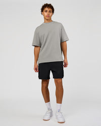 Man wearing AfterDark ZeroCrease Oversized Tee - Alloy | Model:Leandro | Size:M