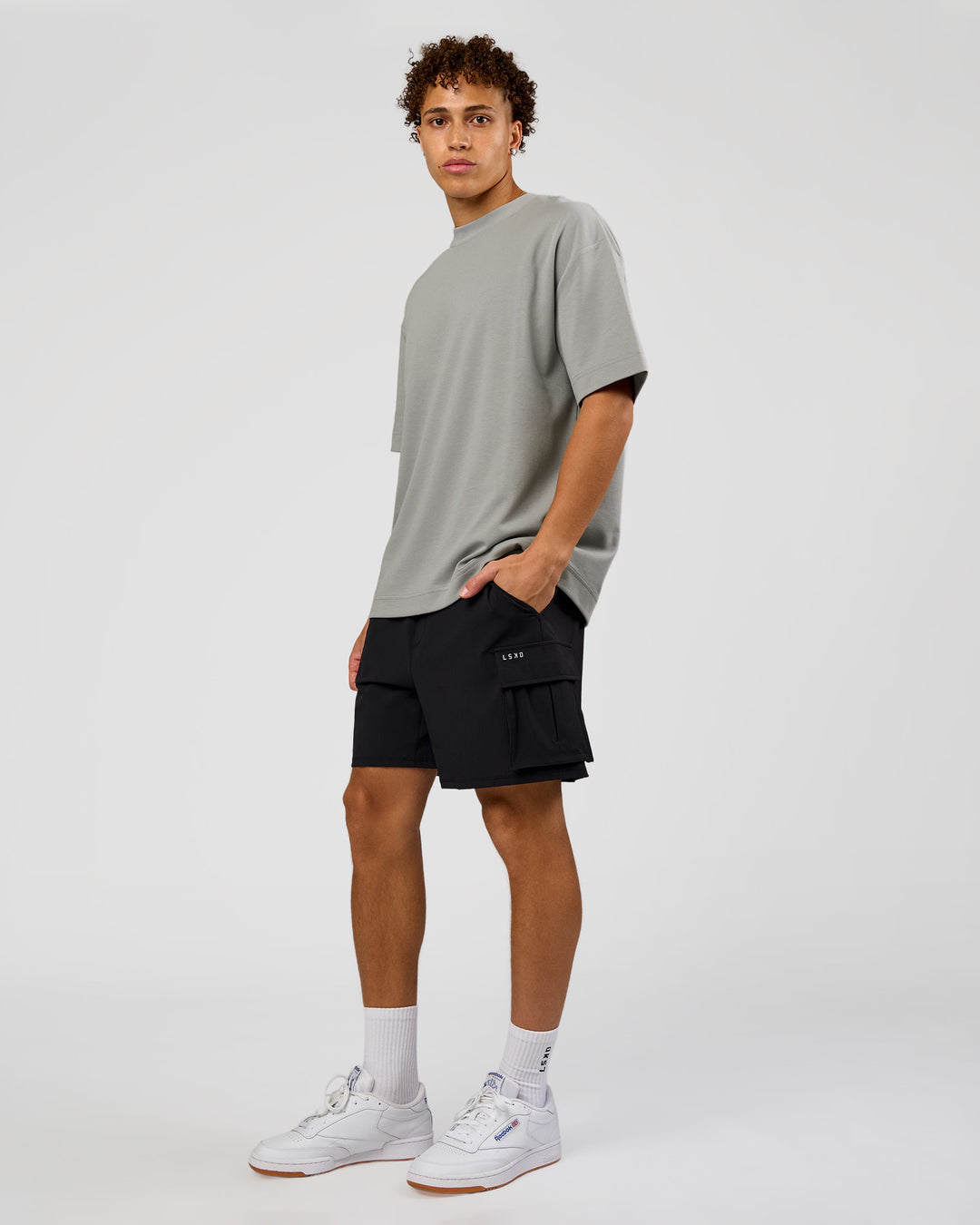 Man wearing AfterDark ZeroCrease Oversized Tee - Alloy | Model:Leandro | Size:M
