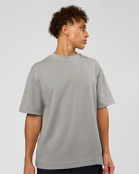 Man wearing AfterDark ZeroCrease Oversized Tee - Alloy | Model:Leandro | Size:M