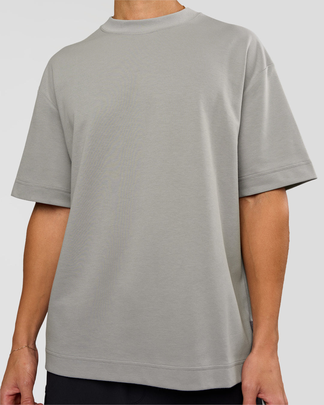 Man wearing AfterDark ZeroCrease Oversized Tee - Alloy | Model:Leandro | Size:M