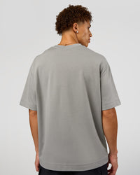 Man wearing AfterDark ZeroCrease Oversized Tee - Alloy | Model:Leandro | Size:M