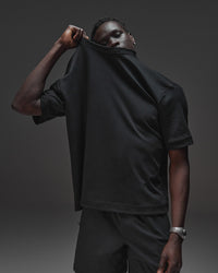 Man wearing AfterDark ZeroCrease Oversized Tee - Black | Model:Mabyro | Size:M | Thumbnail Index: 0