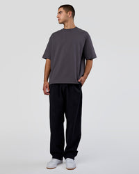 Man wearing AfterDark ZeroCrease Oversized Tee - Dark Storm | Model:Zoran | Size:M