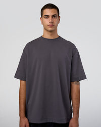 Man wearing AfterDark ZeroCrease Oversized Tee - Dark Storm | Model:Zoran | Size:M