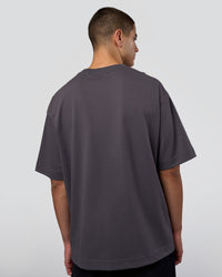 Man wearing AfterDark ZeroCrease Oversized Tee - Dark Storm | Model:Zoran | Size:M