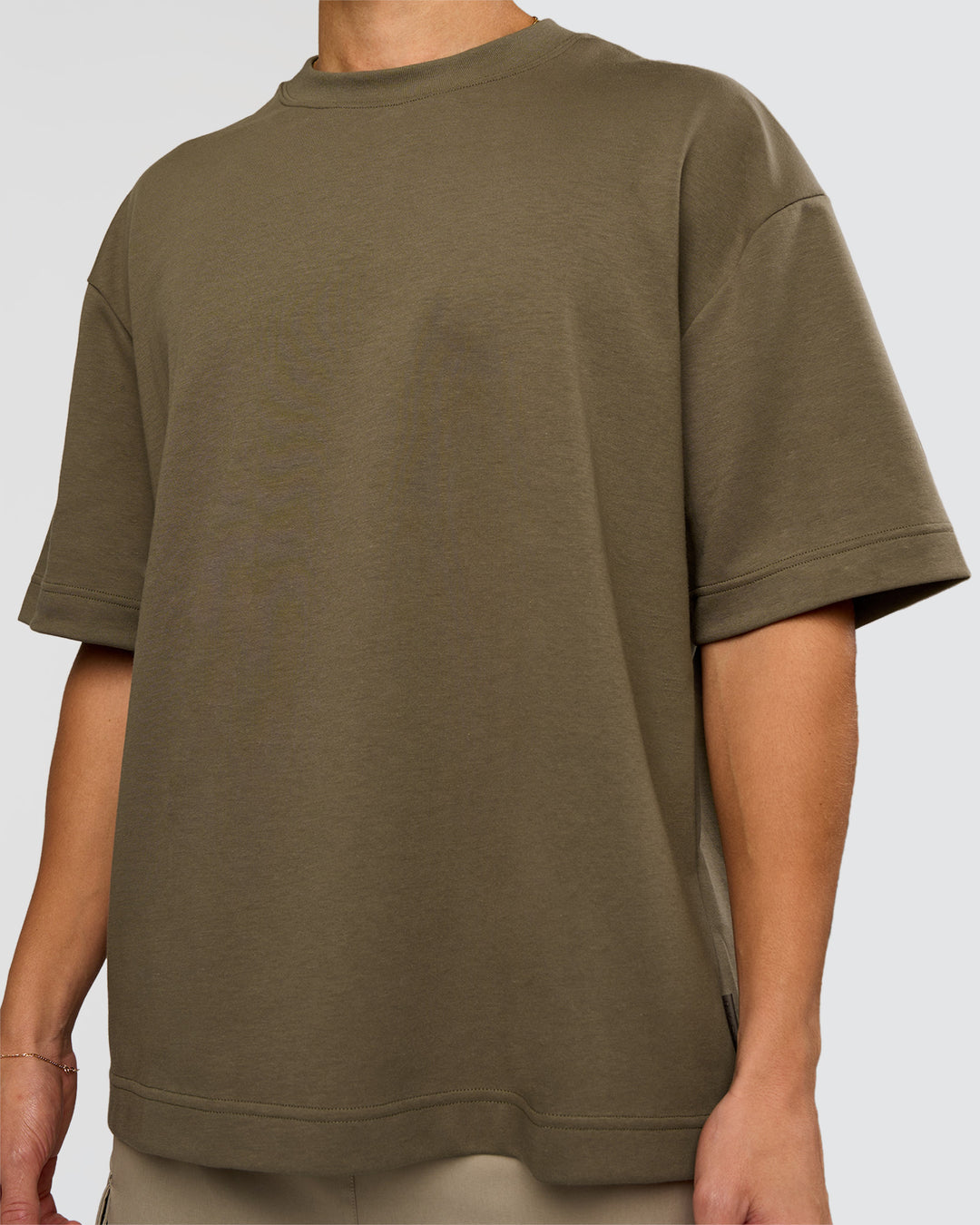 Man wearing AfterDark ZeroCrease Oversized Tee - Walnut Grey | Model:Leandro | Size:M
