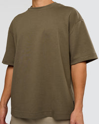 Man wearing AfterDark ZeroCrease Oversized Tee - Walnut Grey | Model:Leandro | Size:M