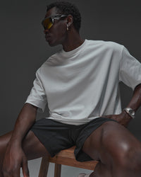 Man wearing AfterDark ZeroCrease Oversized Tee - White | Model:Mabyro | Size:M