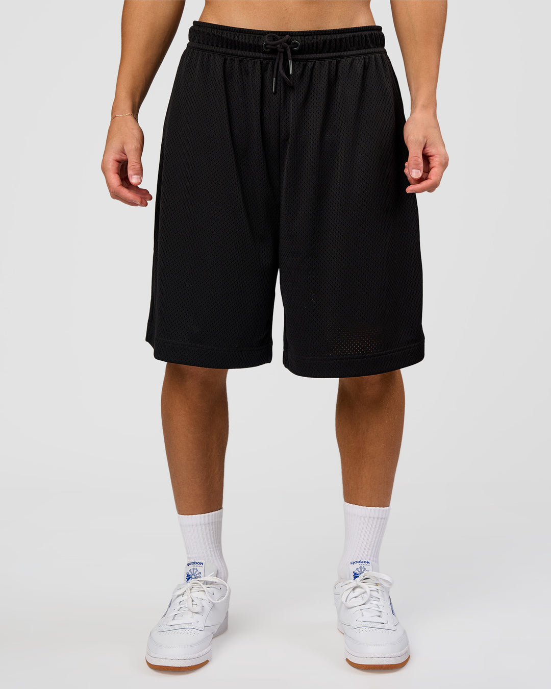 Man wearing AirCore Mesh 7" Short - Black | Model:Leandro | Size:M