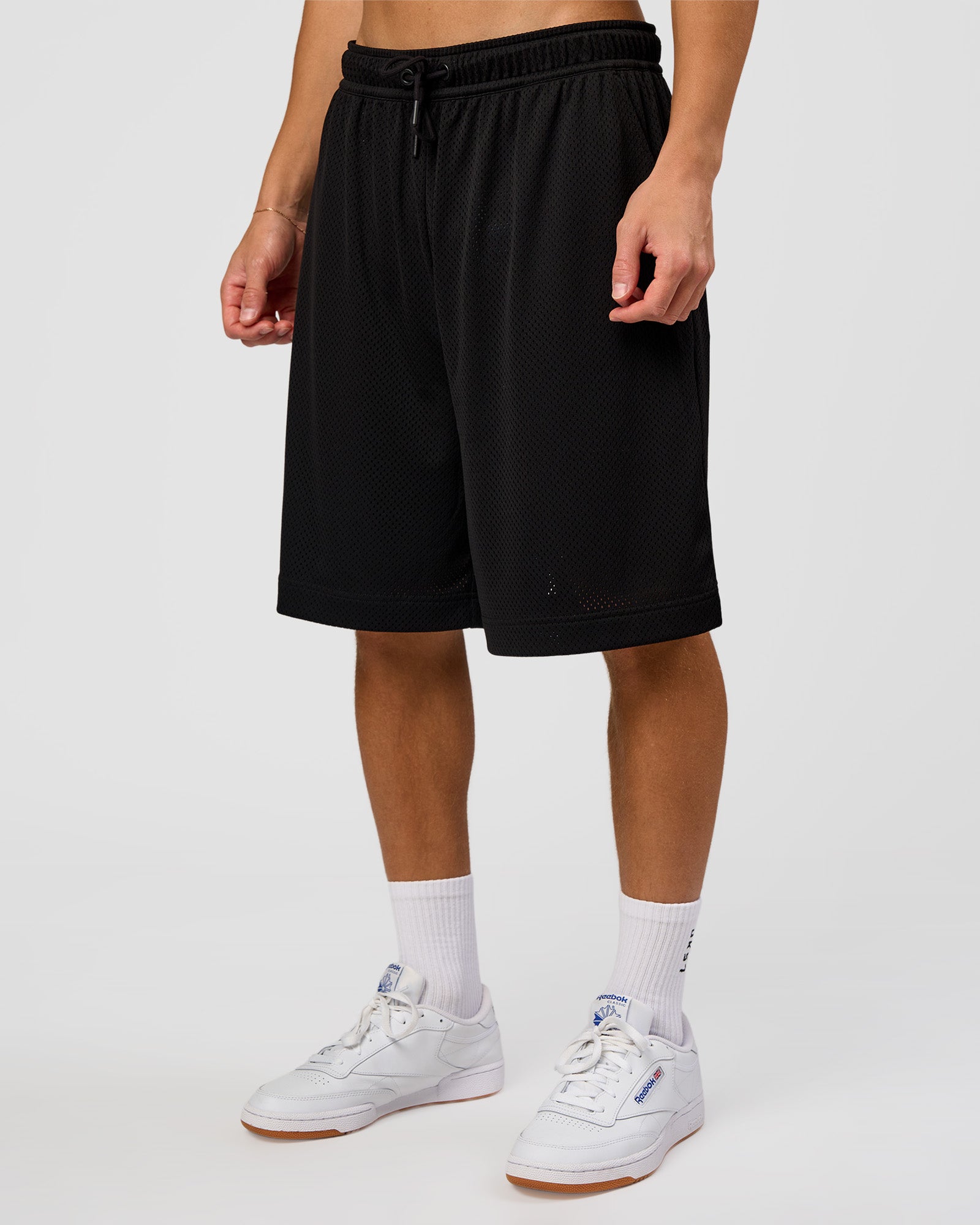 Man wearing AirCore Mesh 7" Short - Black | Model:Leandro | Size:M