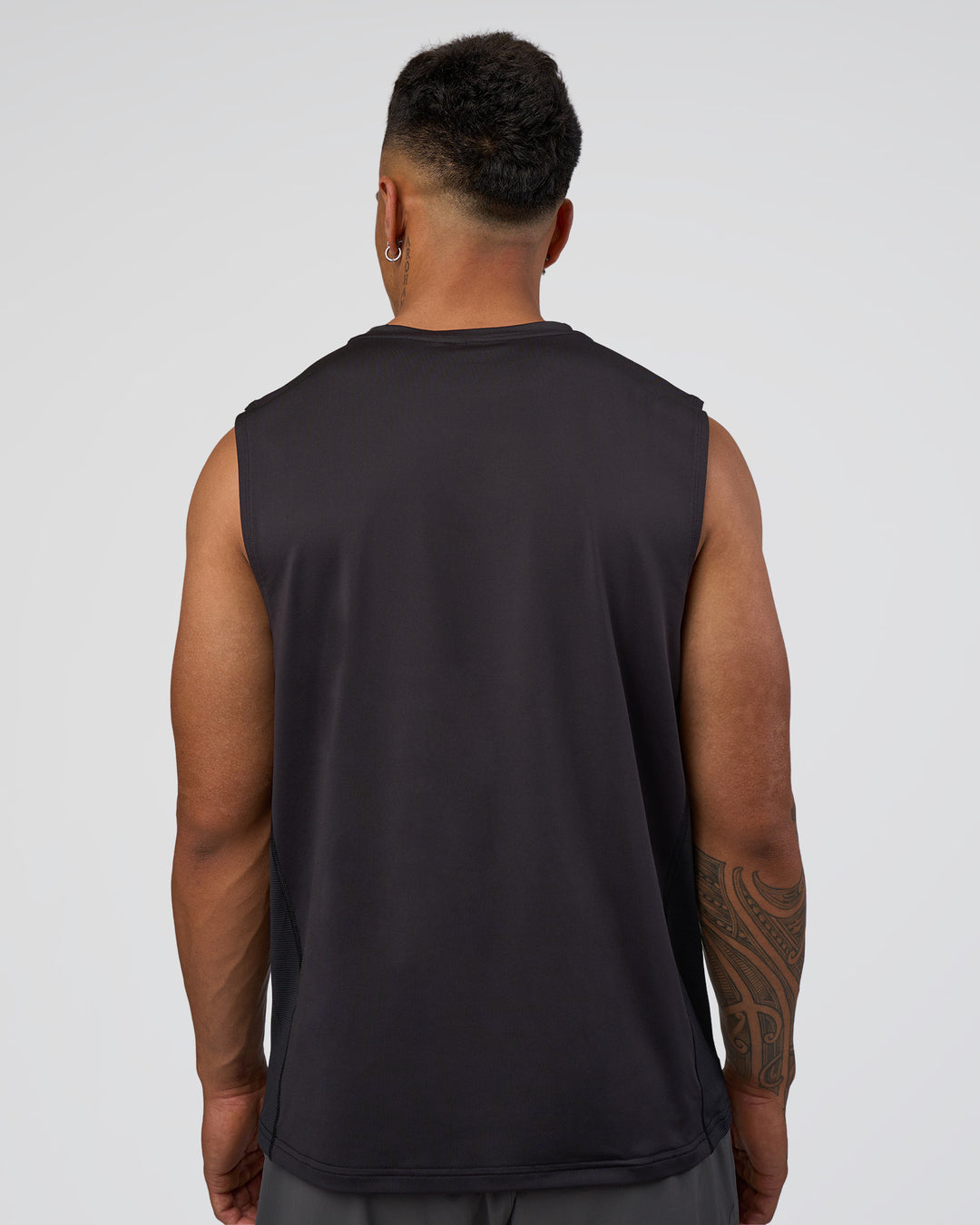 Man wearing AirTrack Muscle Tank - Black | Model:Daarian | Size:M