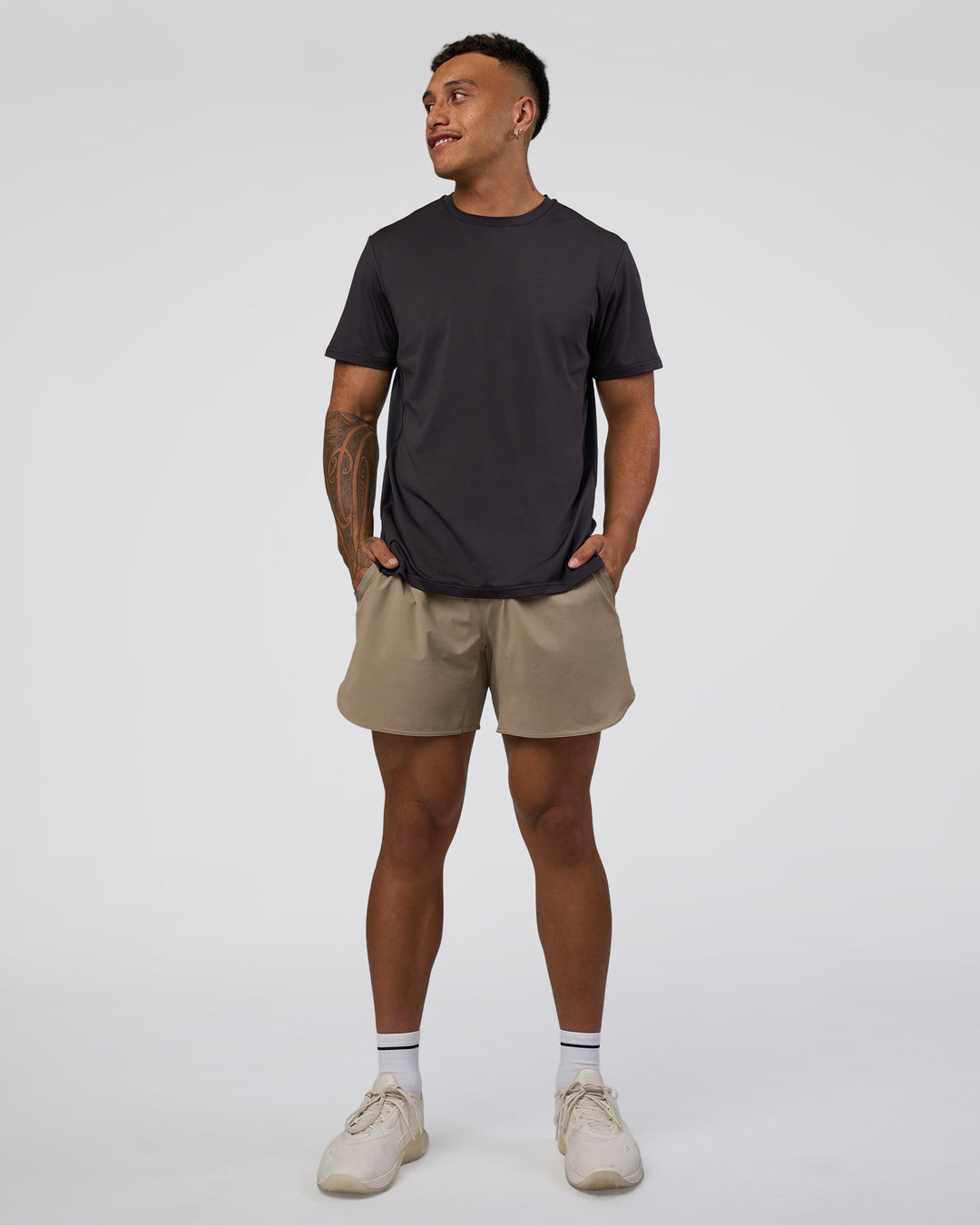 Man wearing AirTrack Tee - Black | Model:Daarian | Size:M