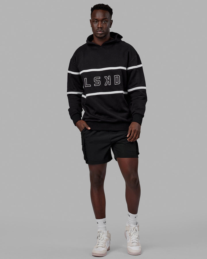 Man wearing Unisex Aligned Hoodie Oversize - Black