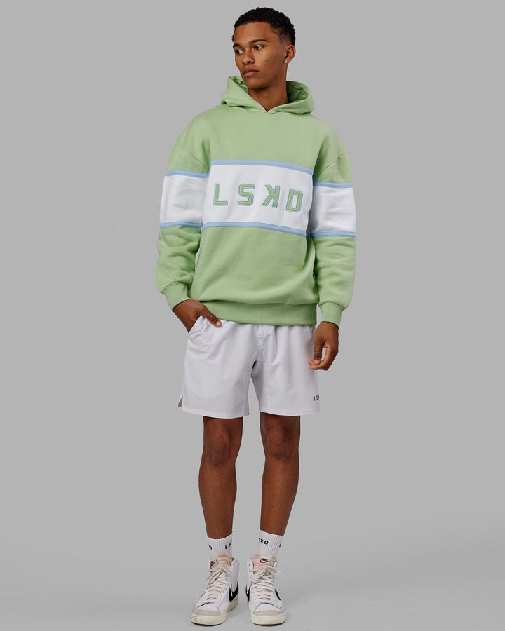 Man wearing Unisex Aligned Hoodie Oversize - Green Fig