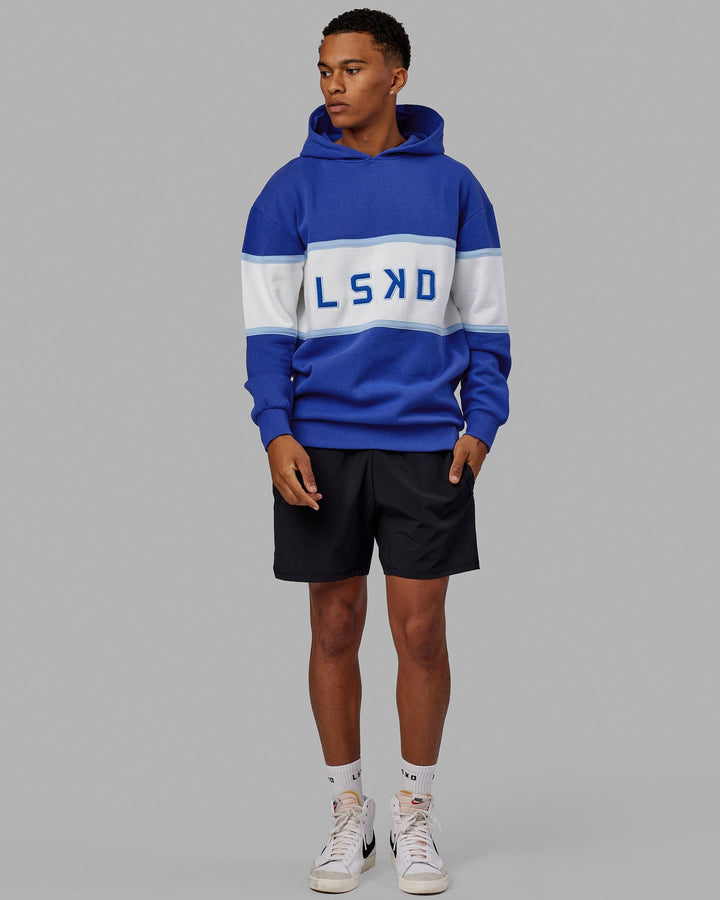 Man wearing Unisex Aligned Hoodie Oversize - Power Cobalt
