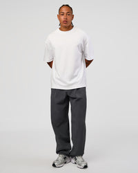 Man wearing All Day ZeroCrease™ Wide Leg Pant - Dark Storm | Model:Malebo | Size:M