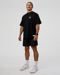 Man wearing Archive FLXCotton Oversized Tee - Black-Open Air | Model:Jaiden | Size:M