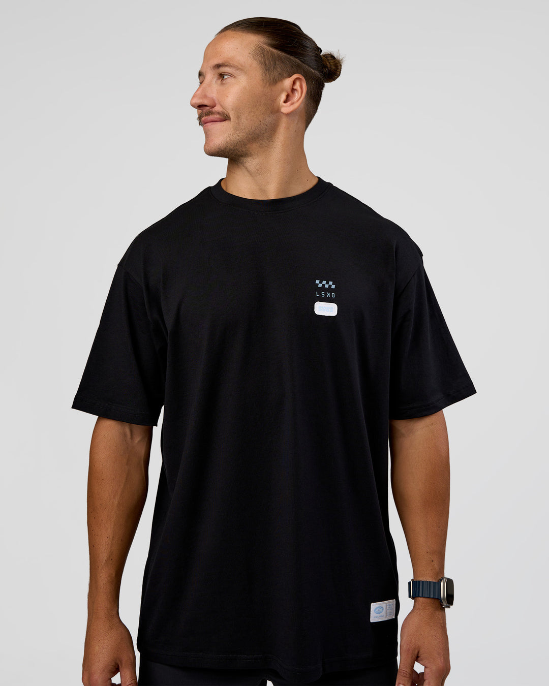 Man wearing Archive FLXCotton Oversized Tee - Black-Open Air | Model:Jaiden | Size:M