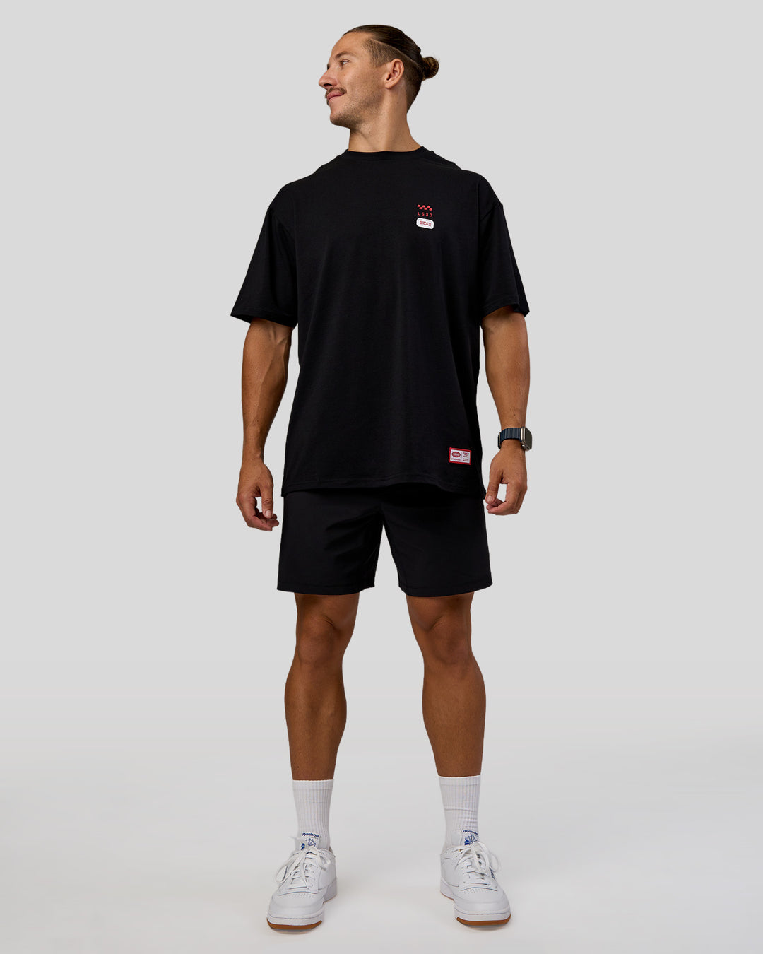 Man wearing Archive FLXCotton Oversized Tee - Black-Scarlet | Model:Jaiden | Size:M