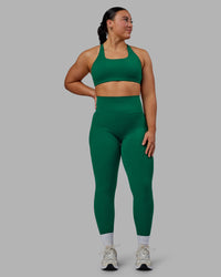 Woman wearing Aspire Sports Bra - Malachite
