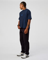 Man wearing Axis Heavyweight Oversized Boxed Tee - Future Navy-Palace Blue | Model:Malebo | Size:M