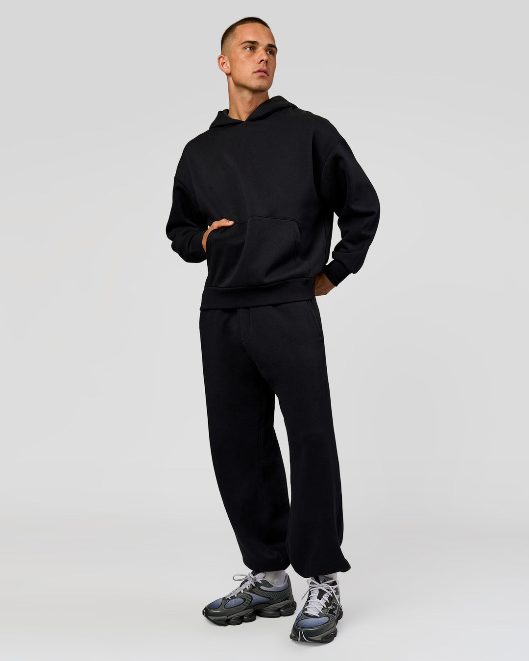 Man wearing Base Baggy Cuffed Track Pant - Black | Model:Albert | Size:M |