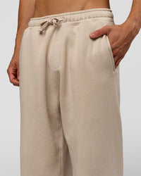 Man wearing Base Baggy Cuffed Track Pant - Shale Beige | Model:Albert | Size:M |