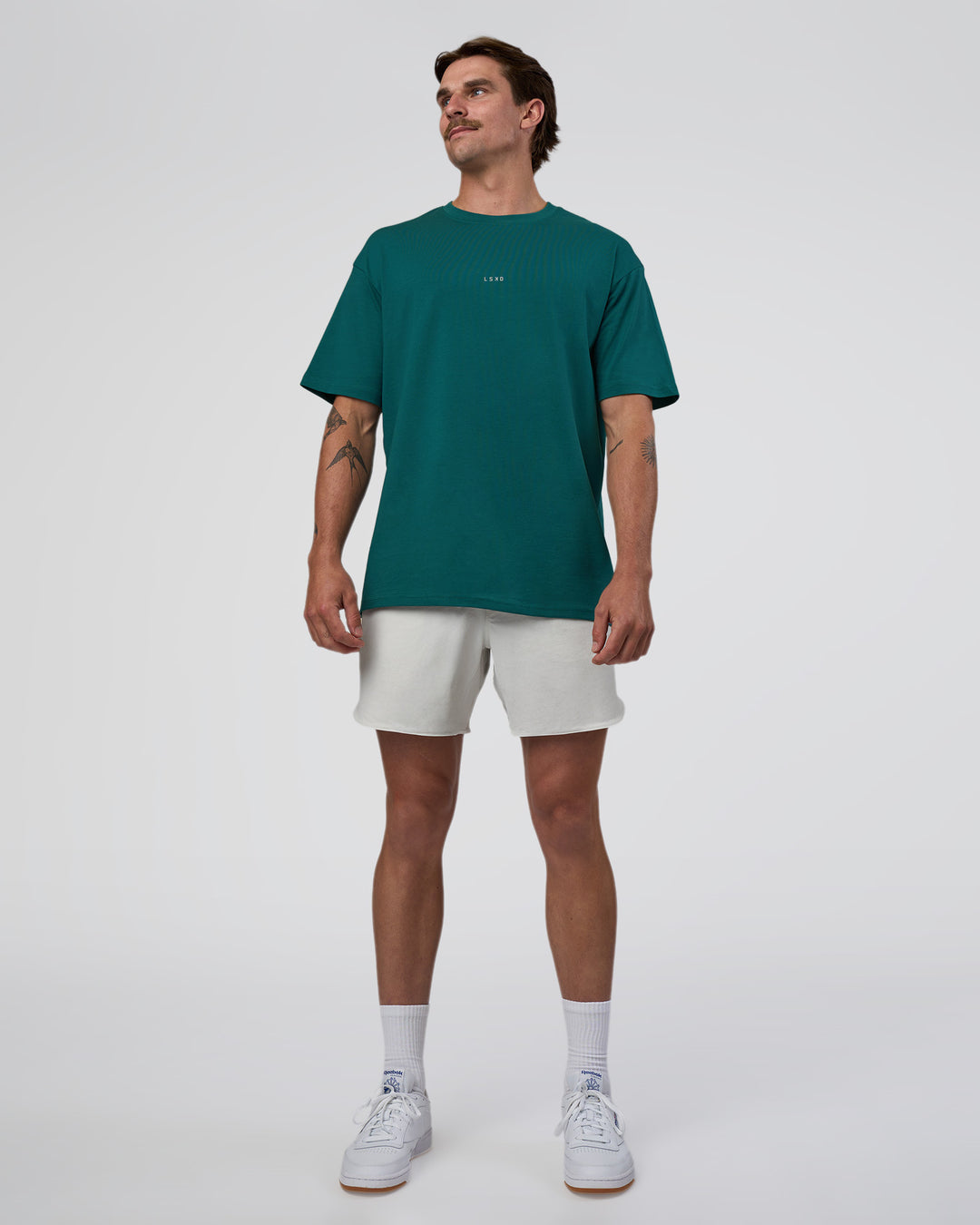 Man wearing Base FLXCotton Tee Oversized - Transformative Teal | Model:Konnor | Size:M