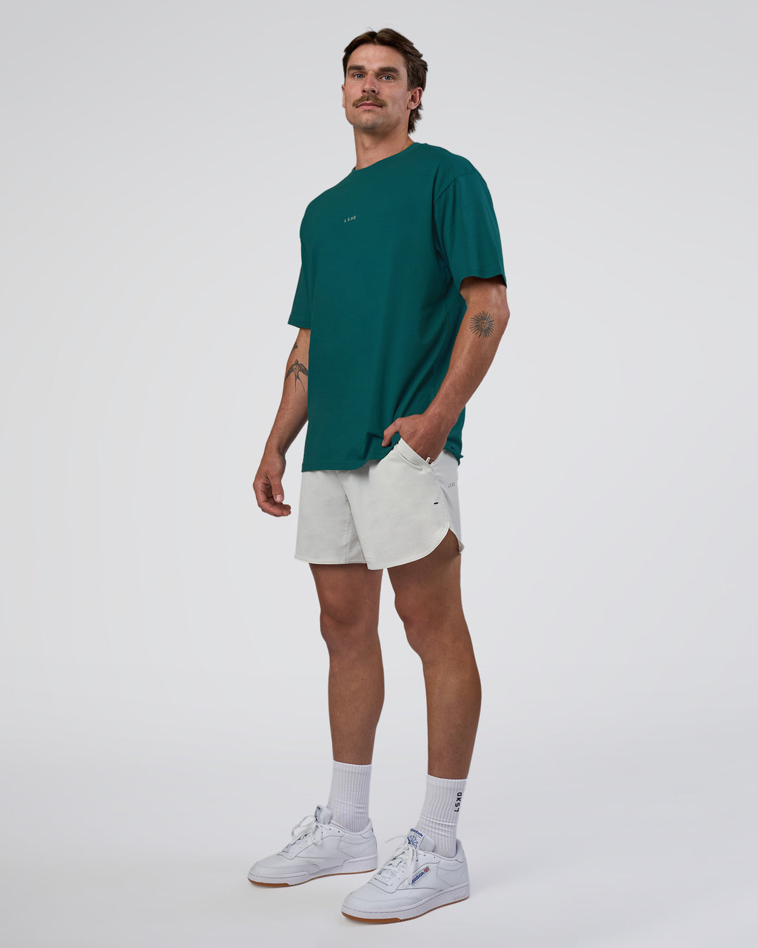 Man wearing Base FLXCotton Tee Oversized - Transformative Teal | Model:Konnor | Size:M