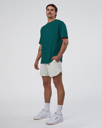 Man wearing Base FLXCotton Tee Oversized - Transformative Teal | Model:Konnor | Size:M