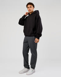 Man wearing Base Oversized Hoodie - Black | Model:Leandro | Size:M |